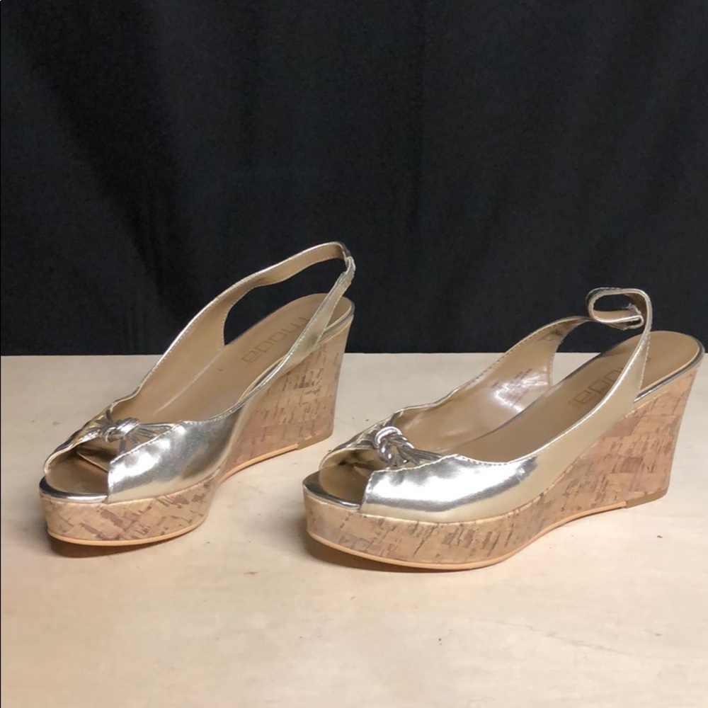 Gold Moda wedged sling backs.